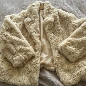 Jou Jou faux fur coat. Worn once. Two button closure has pockets.